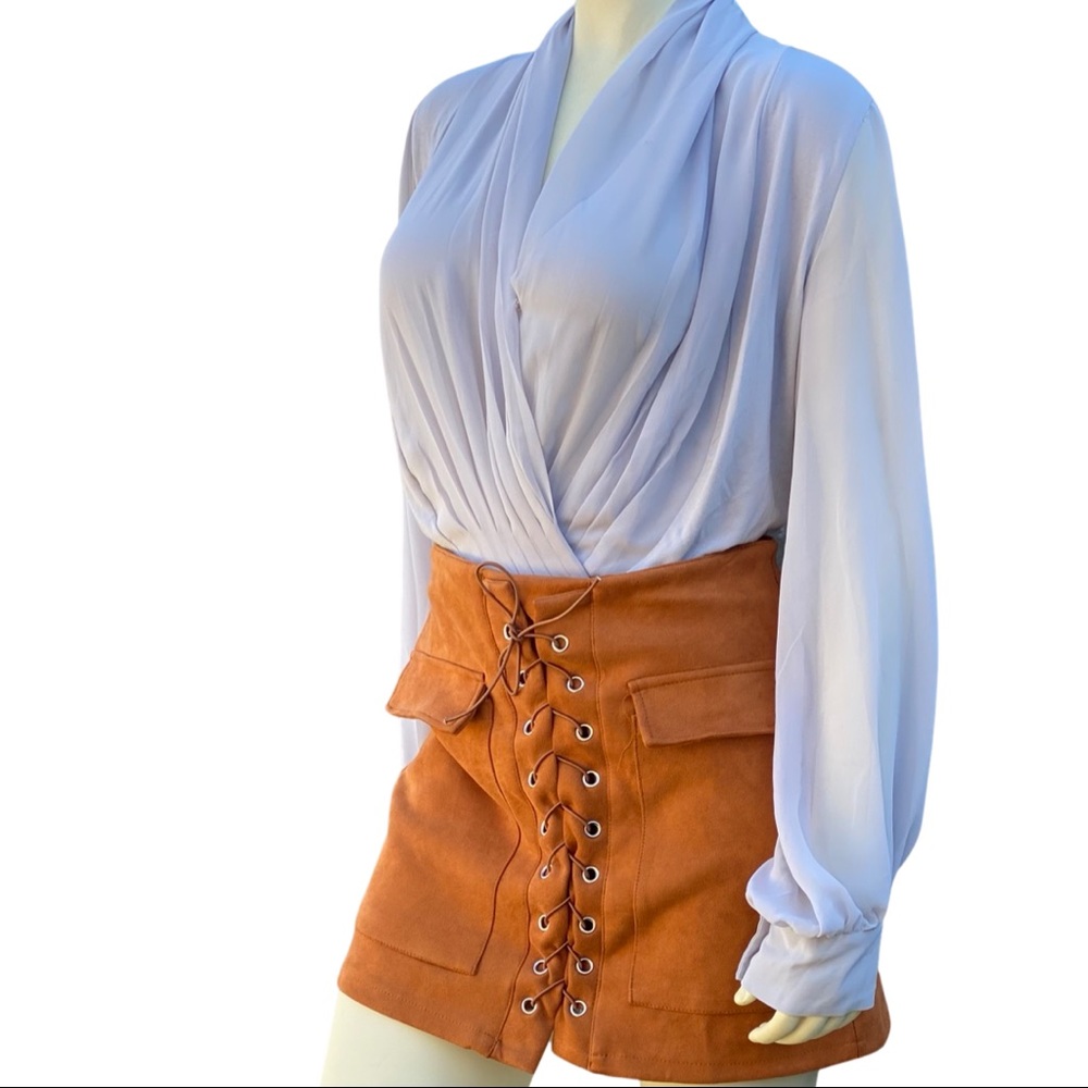 Eva Mendes gray bodysuit with chiffon sleeves and front bodice crossover details